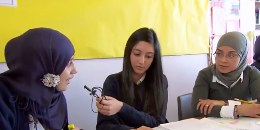 hearing-impaired student working with class mates using a microphone