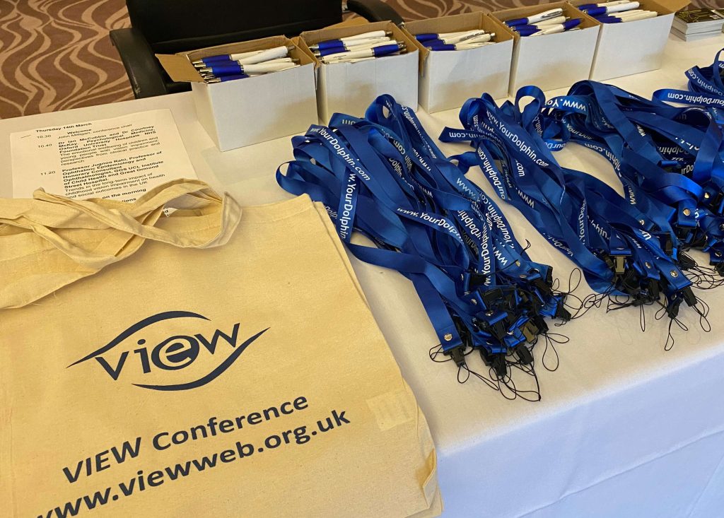 Registration table at VIEW with delegate bag with the words "VIEW Conference, viewweb.org.uk, and VIEW lanyards and pens.